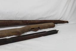 Two wood rifle stocks and one wood forearm. Used.