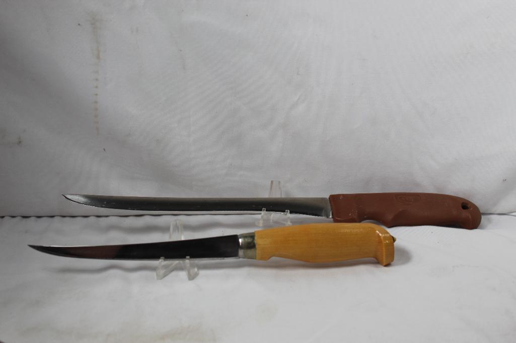 Two fillet knives. One Case with 9.0 inch blade and leather sheath. One Marttiini knife with 6.0