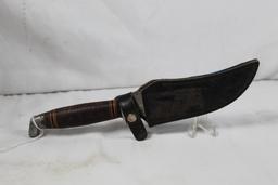 Sheath knife with 5 inch blade. All markings have been ground off. Leather sheath. Rough condition.