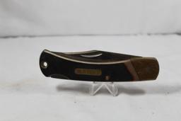 Schrade Old Timer Model 6OT folding hunter with 3.75 inch blade. Saw cut Delrin scales. Used