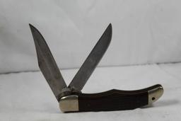 Case 1973 Folding Hunter with two 4 inch blades. Jigged wood scales. In good condition.