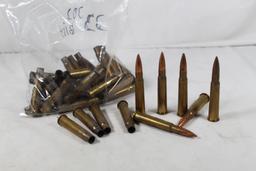 One bag of 303 British, count 6 and one bag of fired 303 British brass cases. Count 33.