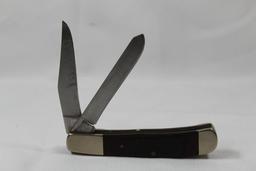 Parker-Edwards trapper with 3.0 inch main blade. Wood scales. Brass handle. Good condition in