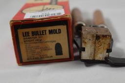 One Lee wood handle single cavity bullet mold 100 gr .311. Used, in box.