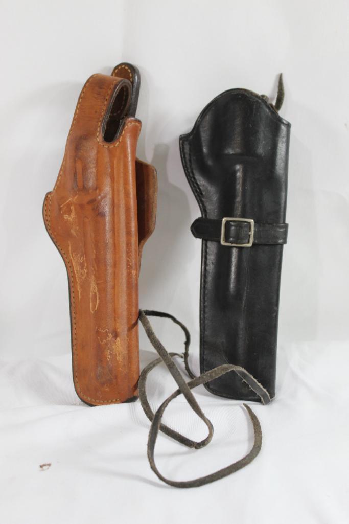 Two leather right handed revolver holsters. Used. Both for 4".