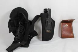 Two nylon right handed holsters and one leather folding ammo pouch. Used.