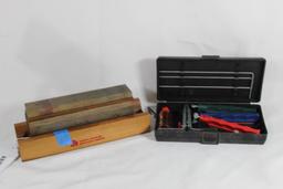 One partial Lansky knife sharpening kit and one Washita 3 sided wet stone knife sharpener. Used.