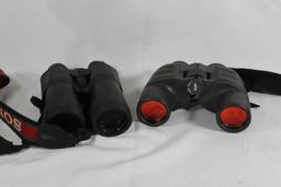 Two pairs of binoculars. One Brunton 7x42, and one Redfield 10x50. Used.