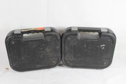 Two Glock pistol cases. Used, both are foam lined.