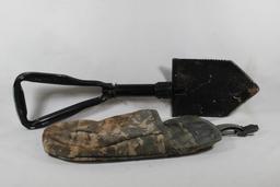 Military style folding shovel in digital camo belt bag. Used.