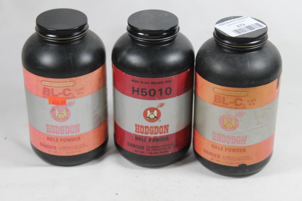 Two partial cans of Hodgdon BL-C reloading powder and one can of Hodgdon 5010 unopened. Note, the