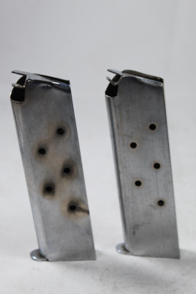 Two 7 round 45 ACP 1911 magazines.