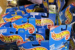 Box of 50 Hot-Wheels cars, in packages.