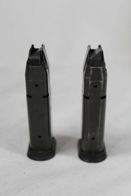Two double stack 40 S&W magazines.