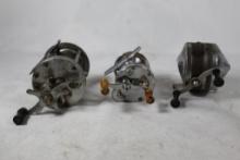 Two older level wind baitcasting reels and one closed face spinning reel. Used.