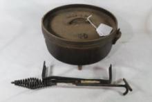 Lodge 10" Dutch oven with lid handle and coal stand. Used.