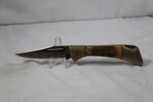 Frost Cutlery single blade lockback with 3 inch blade. Jigged bone scales. Used.