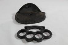 Brass knuckles with black finish in nylon case. New unused. Check local laws before bidding.