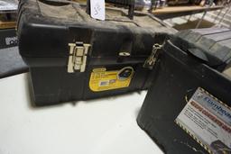 Two black plastic tool boxes. One 19" Stanley and one 17" Flambeau dry box.
