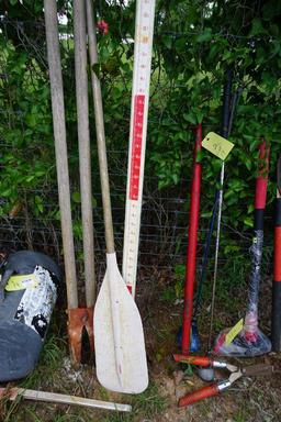 Lot containing tree trimmers, hedge clippers, splitting maul, boat paddle, and two golf clubs