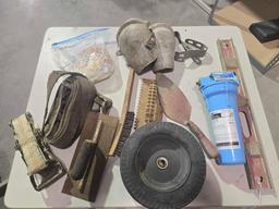 One ratchet strap, one ratchet without the straps, pair of knee pads three concrete trowels, water