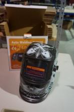 One auto welding helmet. New in box.