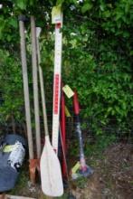 Lot containing tree trimmers, hedge clippers, splitting maul, boat paddle, and two golf clubs