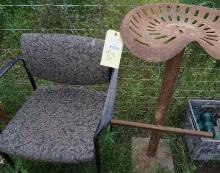 Tractor seat stool on base.