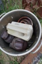 Bucket of old ceramic insulators.