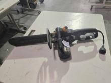 One WORK electric 14" chainsaw. Used.