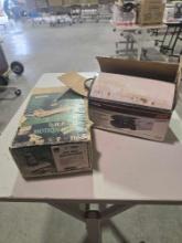 Two electric sanders. One Sears 1/2 hp motion sander, and one one SKIL 3/4 hp belt sander. Both in