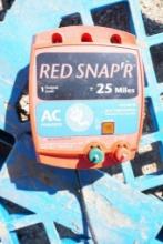Two Red Snap'r electric fence chargers