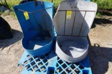 Two feeders made from plastic barrels