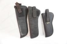 Three black nylon gun holsters