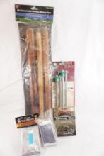 One 55" detachable wood hiking stick, tent stakes, two emergency survival blankets and a survival