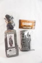One EZ Gun Sling with quick release and one nylon vertical shotgun shell holder, both new in pkg