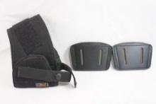 One Uncle Mike's ambidextrous size 10 ankle/leg holster and two Blackhawk leather ambidextrous slide