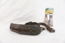 One leather padded rifle sling and one Remington choke tube wrench