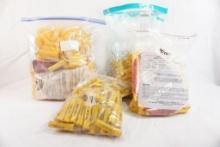 Four bags of Activ yellow 20 gauge shell hulls new in pkg and one bag of Activ fired hulls for