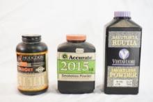 Three partial bottles of reloading powder. One Hodgdon Varget, approx 3/4 full, one Accurate 2015