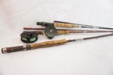 Three fly fishing rods, two with reels. Will not ship local pickup only
