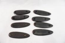 Eight Browning butt plates
