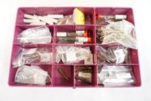Plastic box of various caliber pistol cleaning brushes and mops