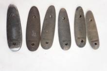 Six metal Remington butt plates