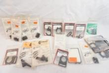 Bag of miscellaneous shotgun accessories including swivel assemblies, sling mounts, and extended