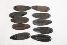 Ten Remington plastic butt plates