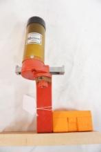 Hornady case/cartridge loader mounted on board with accessories