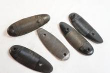 Five Remington butt plates