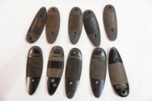 Ten Remington plastic butt plates