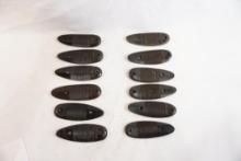 Twelve plastic Remington butt plates